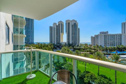 a balcony with a view of the city at Amazing 2Bed - Gym & Tennis Court -Ocean view in Sunny Isles Beach