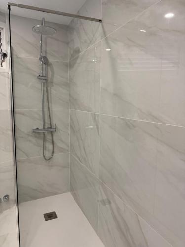 a shower with a glass door in a bathroom at Ocean Glimpse- Las Americas in Costa de Adeje