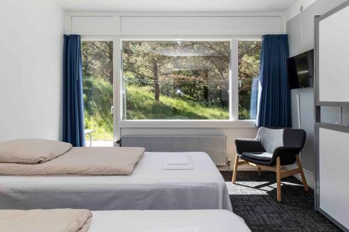 Voodi või voodid majutusasutuse Hotel Toppen af Ebeltoft toas