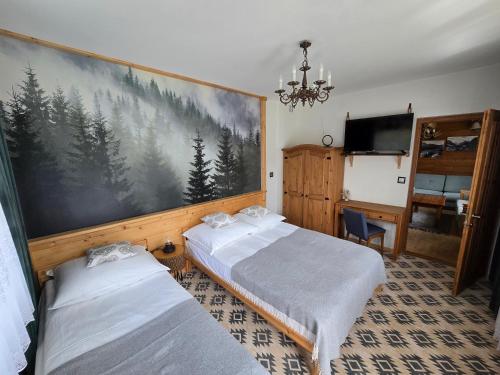 Кровать или кровати в номере Zacisze Pod Reglami & Sauna