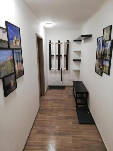 a hallway with pictures on the walls of a room at Apartmány pod Divadlem in Znojmo