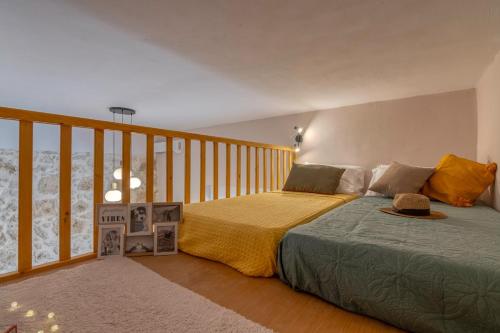 a bedroom with a bed and a balcony at Anamniseis Giorgio Falasarna in Plátanos