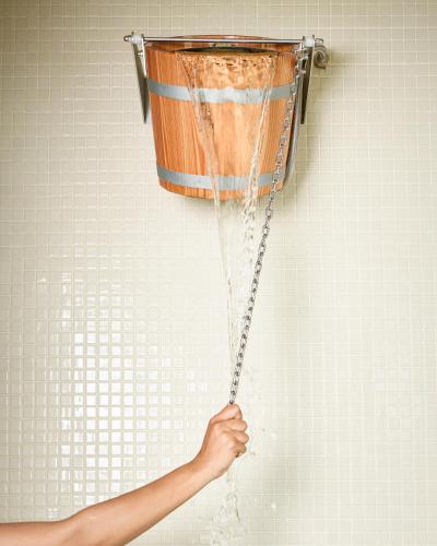 a person holding a bucket on a wall at Le Château de la Tour in Gouvieux