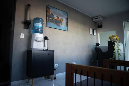 a living room with a lighthouse on the wall at Estação da XV in Telêmaco Borba