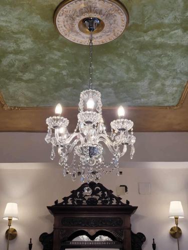 a chandelier hanging from a ceiling in a room at ARCHONTIKO HOTEL Kalymnos in Kalymnos