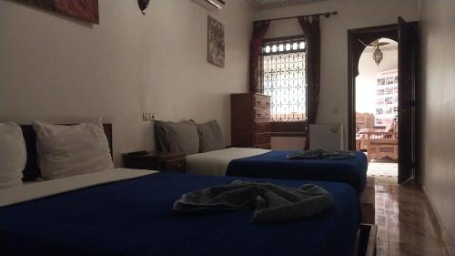 Katil atau katil-katil dalam bilik di Riad Jibril