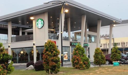 a building with a clock on the front of it at PD D'Wharf High Floor Studio With Private Entrance And Seaview Balcony in Port Dickson