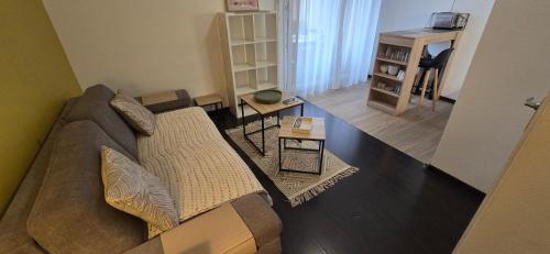 an overhead view of a living room with a couch at Studio cosy, parking et terrasse in Lourdes