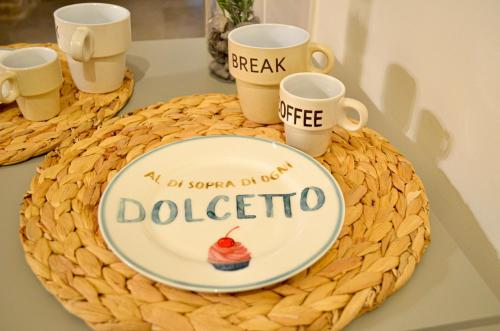 a cake with a cupcake on top of a table at B&B La Casetta di Selly in Ruvo di Puglia