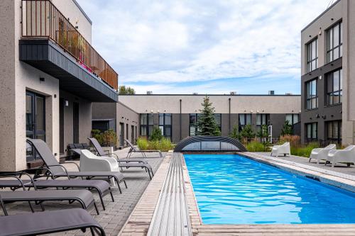 Swimmingpoolen hos eller tæt på Palangos Loftai