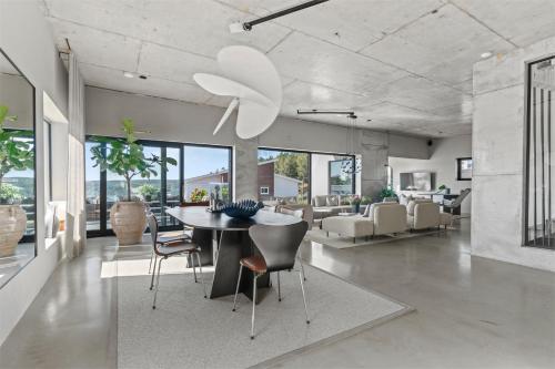 a dining room with a ceiling fan and a table and chairs at Villa Sund in Uddevalla