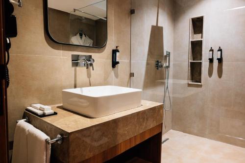 a bathroom with a sink and a shower at NearYo Hotels in Marrakech
