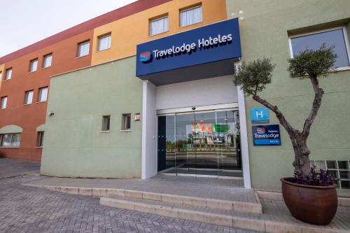 a turquoise industries sign on the front of a building at Travelodge Murcia in Murcia