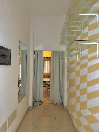 a hallway with a staircase in a room at Cozy Private Apartment For 2 in Cotonou