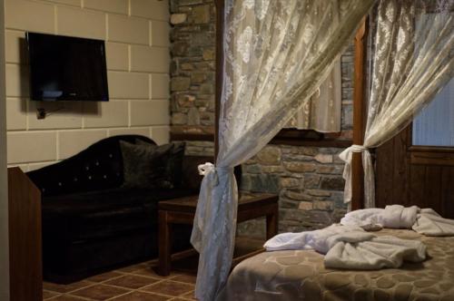 Letto o letti in una camera di Hotel Παραδοσιακό