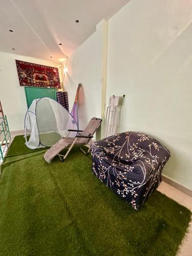 a room with a tent and a bean bag chair at Green Mysore 2BHK Apartment 1km from railway station in Mysore