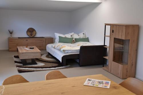 a living room with a couch and a table at Gästehaus in Thüringen in Thüringen