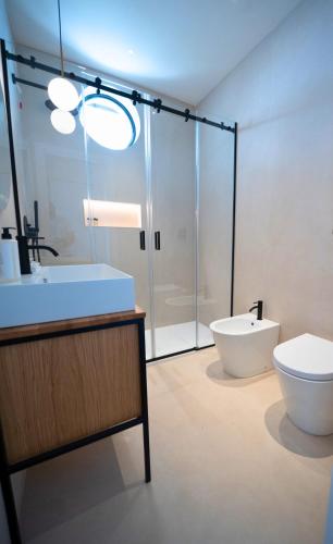 a bathroom with a shower and a toilet and a sink at SetSail in Vibo Valentia Marina