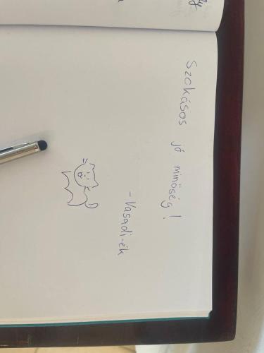 a white board with a drawing of a monkey on it at RoseHill Garden Family Villa with a Great Budapest View in Budapest