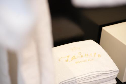 a towel sitting on top of a box at La Suite Boutique Hotel in Tirana