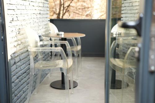 a row of tables and chairs in a restaurant at La Suite Boutique Hotel in Tirana