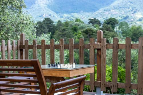 a chess board on a table in front of a fence at Villa Daniela in Camaiore