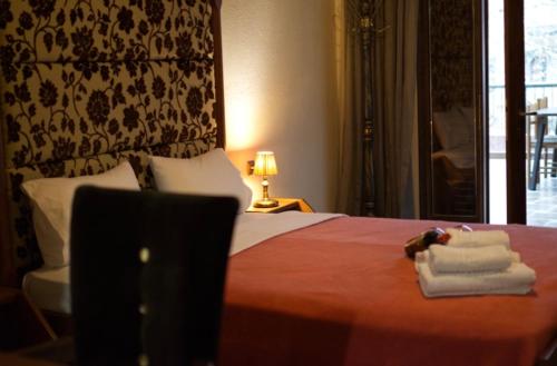 Letto o letti in una camera di Hotel Παραδοσιακό