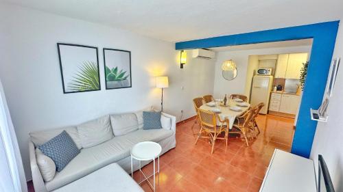 a living room with a couch and a table at Nomad Haux in the heart of Tossa 9 in Tossa de Mar