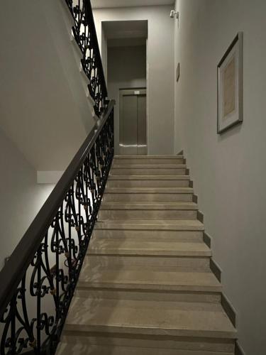 a staircase leading up to a hallway with a door at Villa Brandestini in Pula