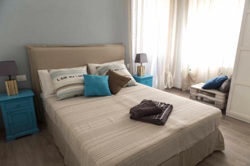 a bedroom with a large bed with two pillows at La Casa Di Titti in Civitanova Marche