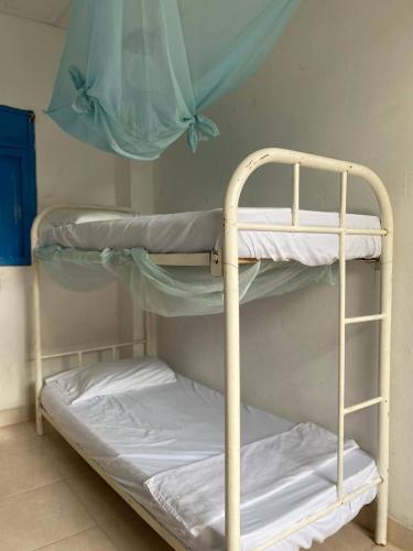 a couple of bunk beds in a room at Sauka Loft Hostel in Rincón