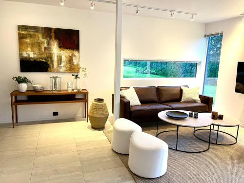 a living room with a couch and a table at Arctic magic in the heart of Tromsø in Tromsø