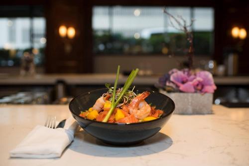 a bowl of food sitting on a table at Victoria Marriott Inner Harbour in Victoria