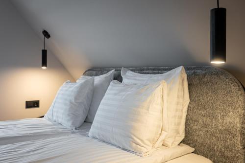 Katil atau katil-katil dalam bilik di Comfort Apartments Palanga