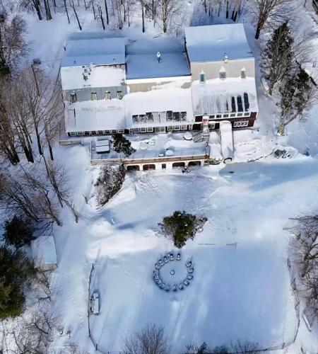 an aerial view of a house covered in snow at The birch House Heated Pool, Sauna, Hot Tub & More in Dover
