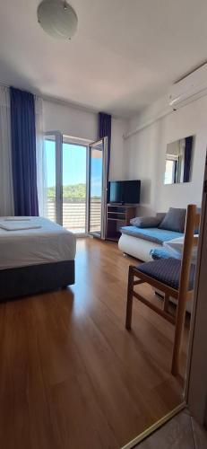 Ένα ή περισσότερα κρεβάτια σε δωμάτιο στο Apartmani Vuković