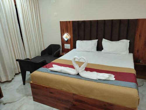 Una cama o camas en una habitación de Nandi residency