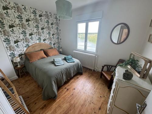 a bedroom with a bed and a window at Villa Jeanne in Saint-Nazaire-en-Royans