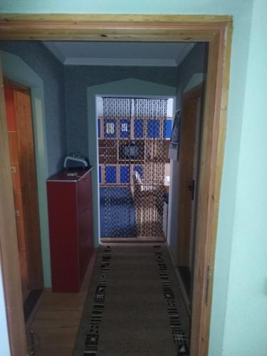 a hallway with a door leading into a room at Stefke in Lučani