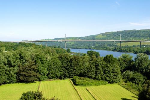 an aerial view of a bridge over a river and a field at Muthu Glasgow River Hotel in Erskine