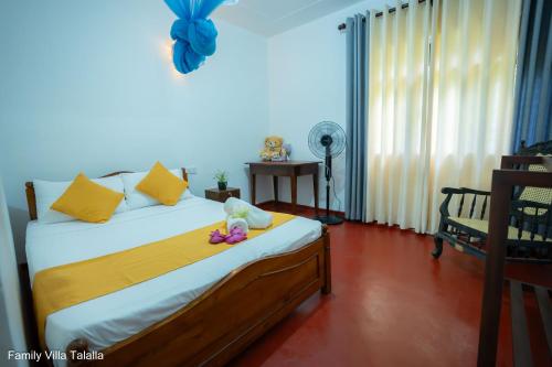 a bedroom with a bed with a stuffed animal on it at Family Villa Talalla in Talalla