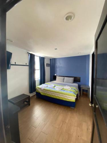 Ένα ή περισσότερα κρεβάτια σε δωμάτιο στο Hotel Santo Domingo
