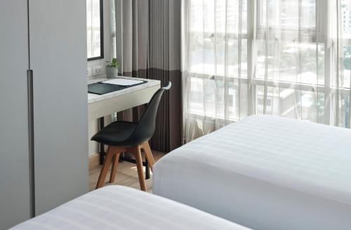 Ένα ή περισσότερα κρεβάτια σε δωμάτιο στο Shama Lakeview Asoke Bangkok