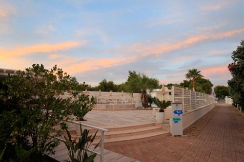 a view of a amphitheater with stairs and trees at Garden Hotel Ripa in Vieste