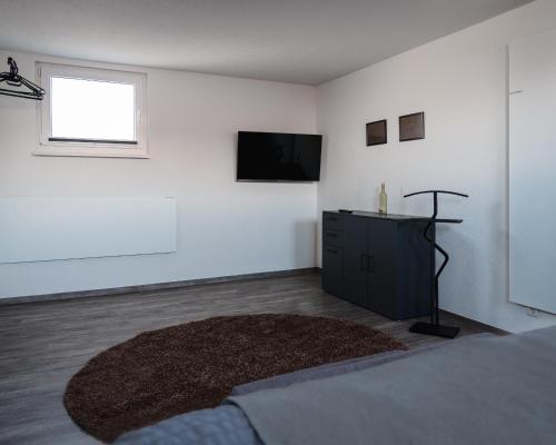Μια τηλεόραση ή/και κέντρο ψυχαγωγίας στο Ferienhaus Zur Lore 13