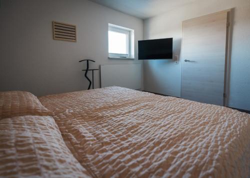 Ένα ή περισσότερα κρεβάτια σε δωμάτιο στο Ferienhaus Zur Lore 13