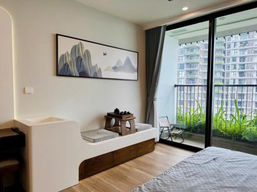 a bedroom with a bed and a large window at Swanlake ecopark Hanoi-Calm homestay in Kim Quan