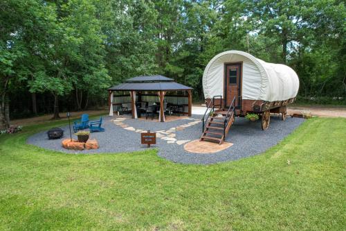 a round yard with a dome tent and a gazebo at Secluded Luxury Wagon with Pond, King Bed, Full Bath, Patio in Montgomery