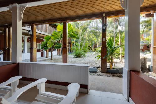 a lobby with two white chairs and a table at Grand Muthu Runaway Bay Club Caribbean in Runaway Bay