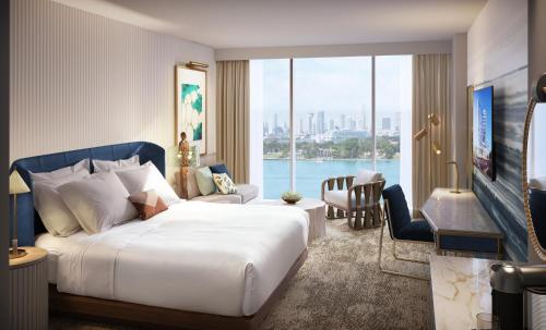 a hotel room with a bed and a large window at Omni Fort Lauderdale Hotel in Fort Lauderdale